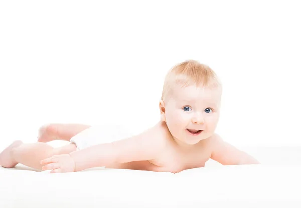 Aranyos, mosolygós, csecsemő baba csúszó portréja — Stock Fotó