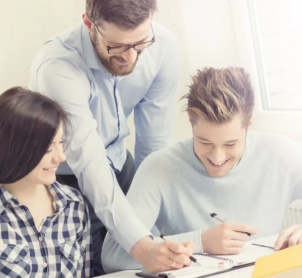 Group of teenage students and teacher — Stock Photo, Image