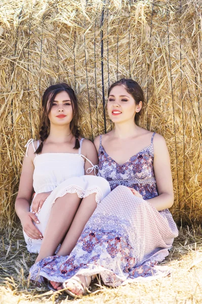 Young and happy women sitting — Stock Photo, Image