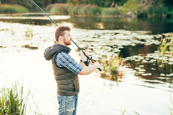 Rybář s pruty — Stock fotografie