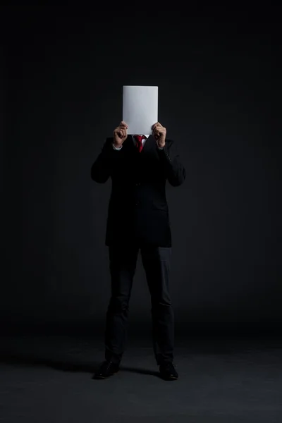 Businessman with blank paper — Stock Photo, Image