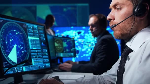 Workplace of the air traffic controllers in the control tower. Team of aircraft control officers works using radar, computer navigation and digital maps. Aviation concept. — Stock Video