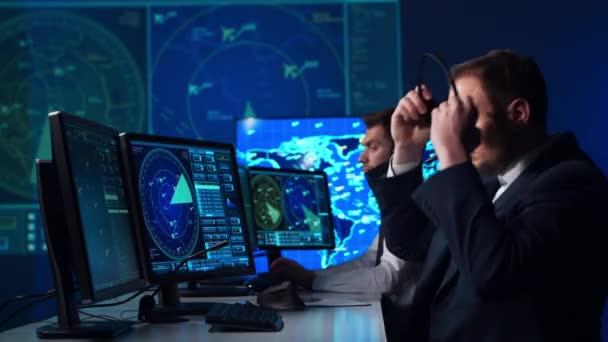 Workplace of the air traffic controllers in the control tower. Team of aircraft control officers works using radar, computer navigation and digital maps. Aviation concept. — Stock Video