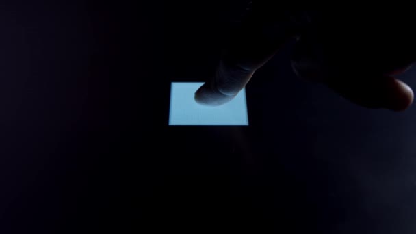 Human finger is pressing a digital button on a glowing touchscreen. Futuristic microprocessor is starting the operation of the computer program. Machine learning and artificial intelligence. — Stock Video