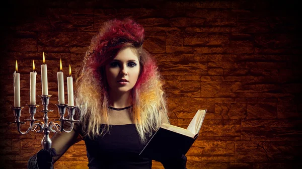 Young and beautiful witch making witchcraft — Stock Photo, Image