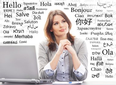 Young businesswoman working on a laptop clipart