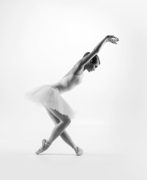 Young female ballet dancer performing a move
