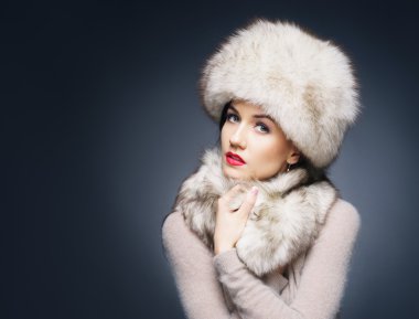 Woman in  warm winter hat clipart