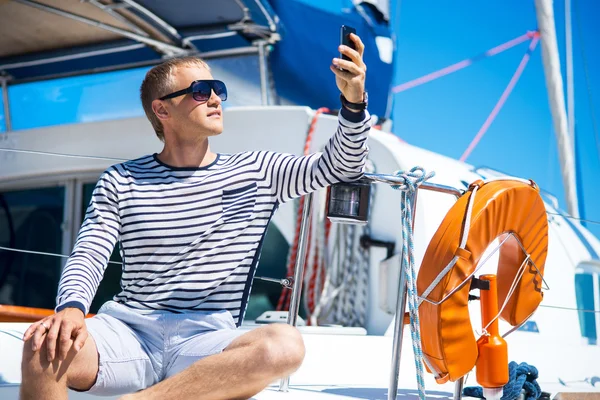 Handsome man on sailing boat — Stock Photo, Image