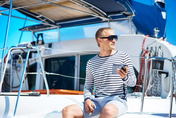 Handsome man on sailing boat — Stock Photo, Image