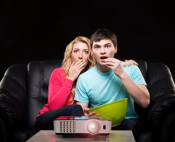 Family watching movie on laser projector — Stock Photo, Image