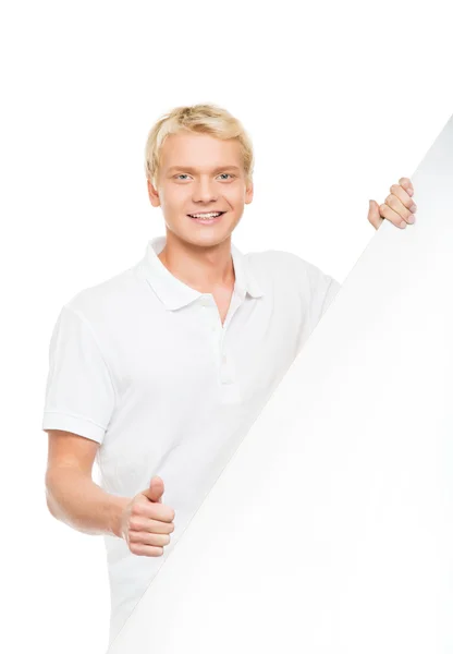 Homem bonito segurando outdoor em branco — Fotografia de Stock