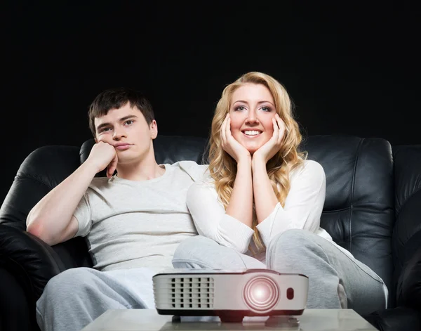 Couple watching movie on projector — Stock Photo, Image