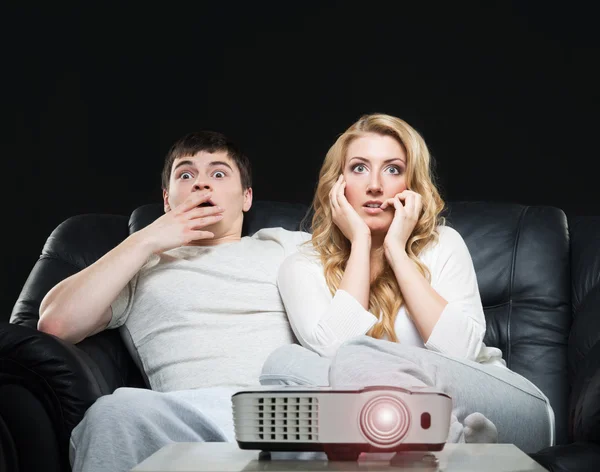 Couple watching movie on projector — Stock Photo, Image