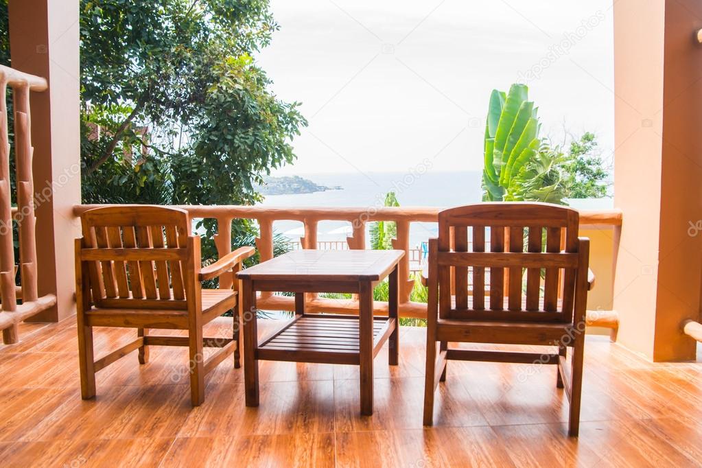 Two chairs and table on balcony