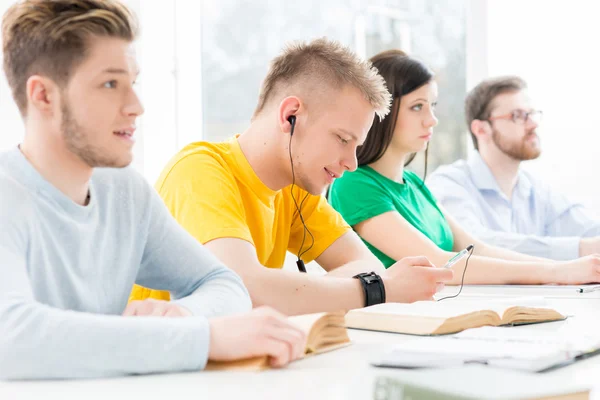 Teenage students studying at  lesson — Stock Photo, Image