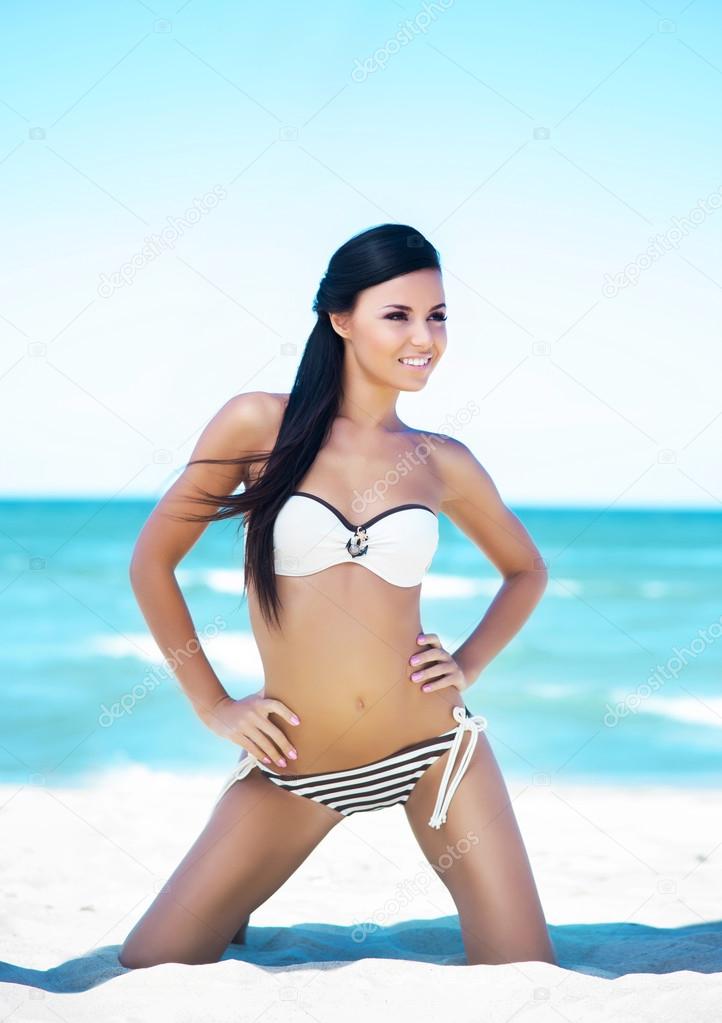 Young happy woman on  beach