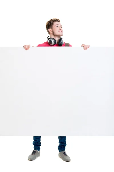 Happy teenager holding  blank banner — Stock Photo, Image