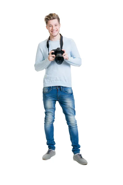 Фотограф держит фотокамеру — стоковое фото