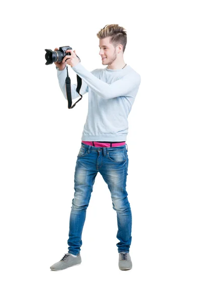 Photographer holding photo camera — Stockfoto