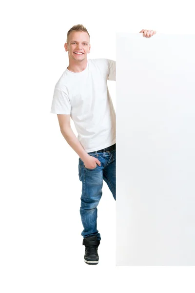 Teenager boy holding blank banner — Stock fotografie