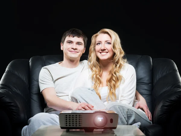 Family watching  movie on  projector — Stock Photo, Image