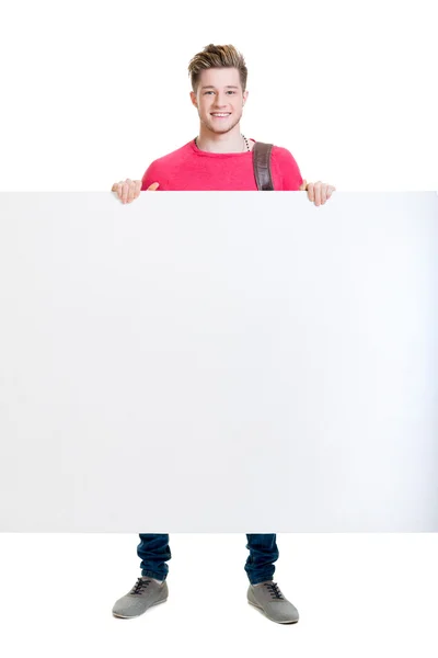 Happy teenager holding blank banner — Stock Photo, Image