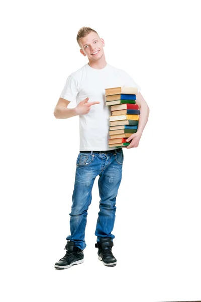 Estudiante sosteniendo pila de libros Imagen De Stock