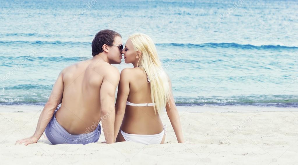 Man and woman  kissing on beach