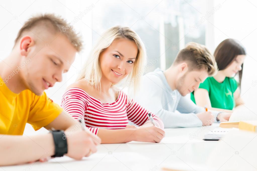 teenage students studying at the lesson