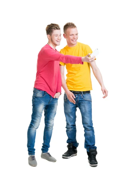 Two happy friends making selfies on isolated background — Stock Photo, Image