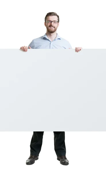 Hombre feliz en ropa formal con una barba sosteniendo una pancarta sobre un fondo aislado —  Fotos de Stock