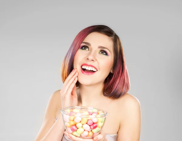 Woman with bowl of sweets — Stock Photo, Image