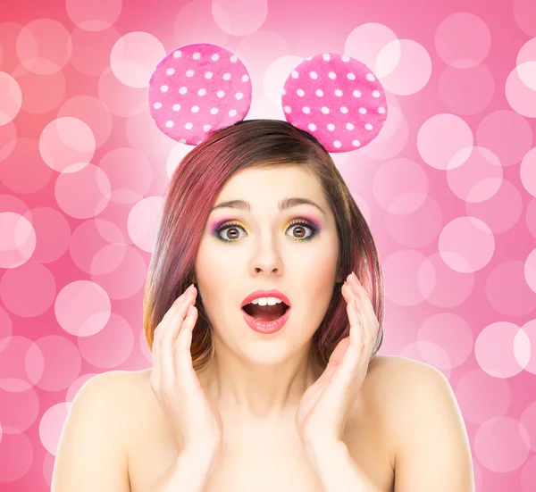 Surprised woman in mickey mouse ears — Stock Photo, Image