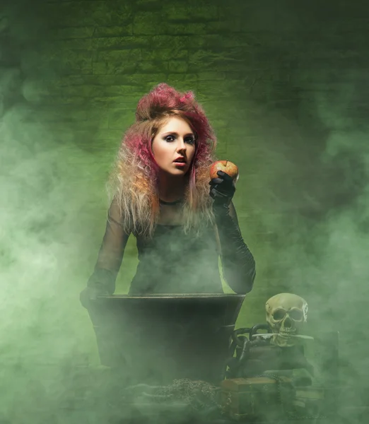 Witch conjuring in dungeon Stock Picture