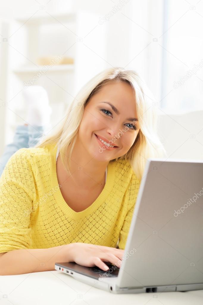 woman using laptop at home