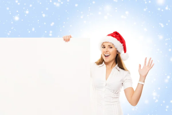 Mujer en Santa sombrero con cartelera en blanco — Foto de Stock