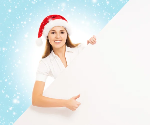 Donna in cappello Babbo Natale con cartellone bianco — Foto Stock