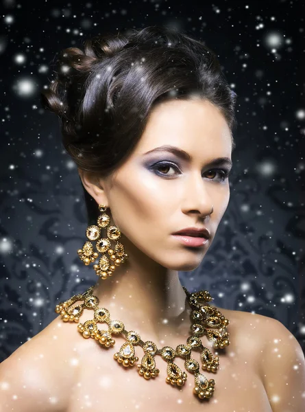 Woman in jewel necklace and earrings — Stock Photo, Image