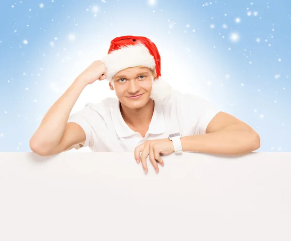 Hombre en sombrero de Navidad con cartelera en blanco — Foto de Stock