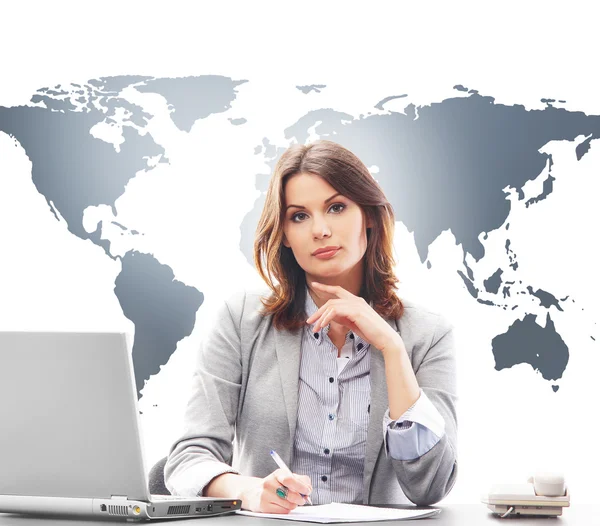 Beautiful business woman in office on world map background — Stock Photo, Image