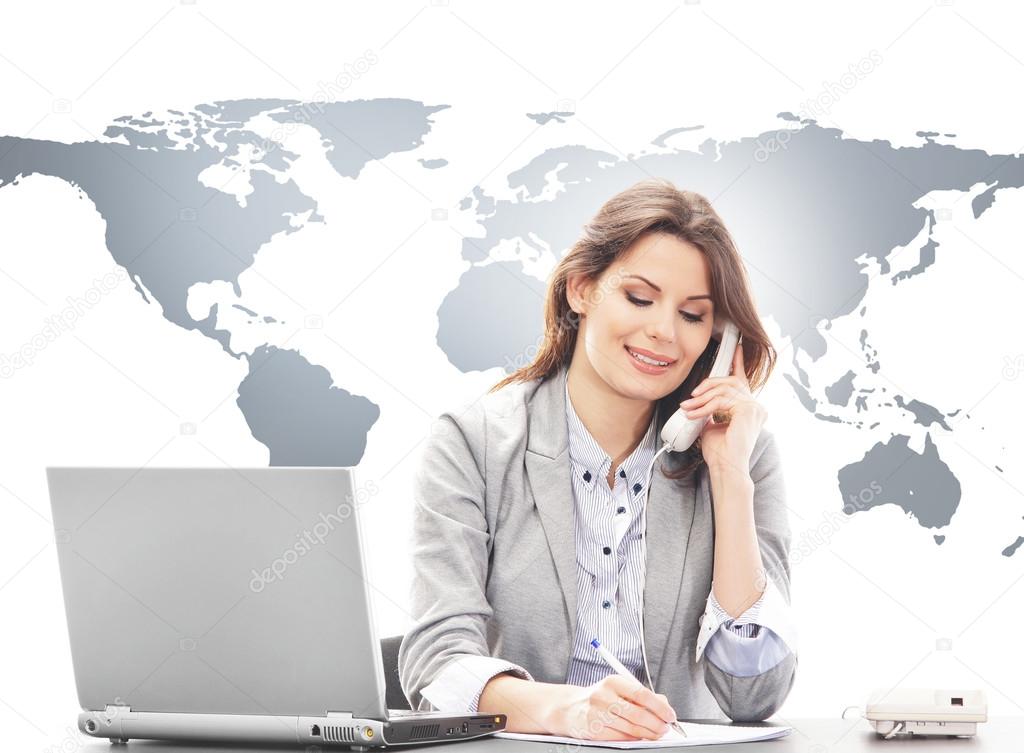 Beautiful business woman answering international calls