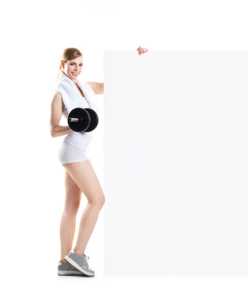 Young and fit woman with dumbbells — Stock Photo, Image