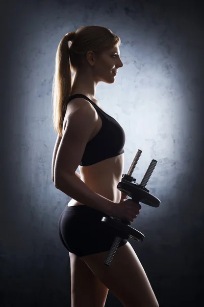 Woman having a dumbbell training — Stock Photo, Image