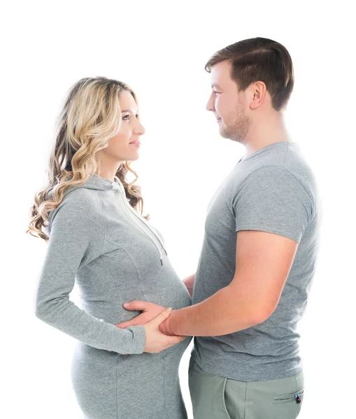 Husband and pregnant wife hugging each other — Stock Photo, Image