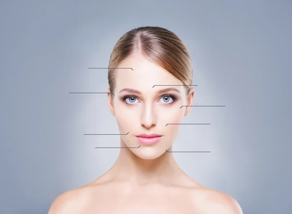 Woman with arrows pointing on her face — Stock Photo, Image