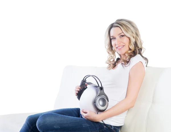 Woman giving her baby to listen to the music — Stock Photo, Image