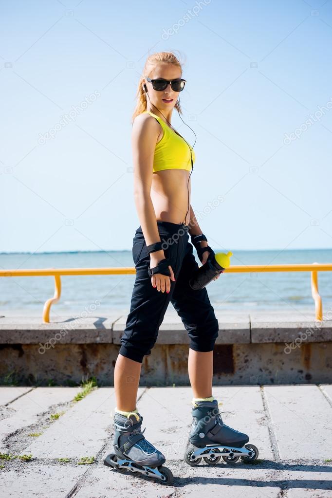 Sporty girl rollerblading on inline skates — Stock Photo © shmeljov