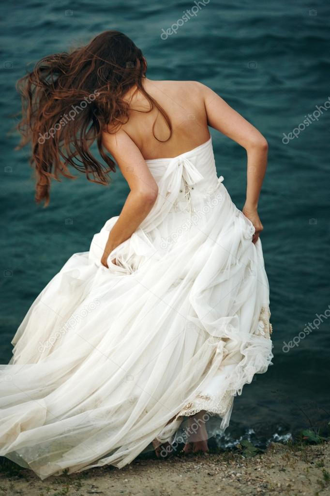 Woman in White near Stormy Sea