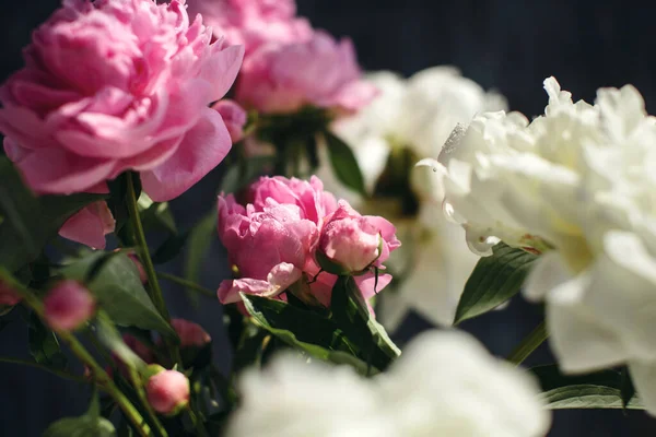 Dreamy flower bouquet of pink natural peonies flowers, spring and summer season bouquet, selective focus